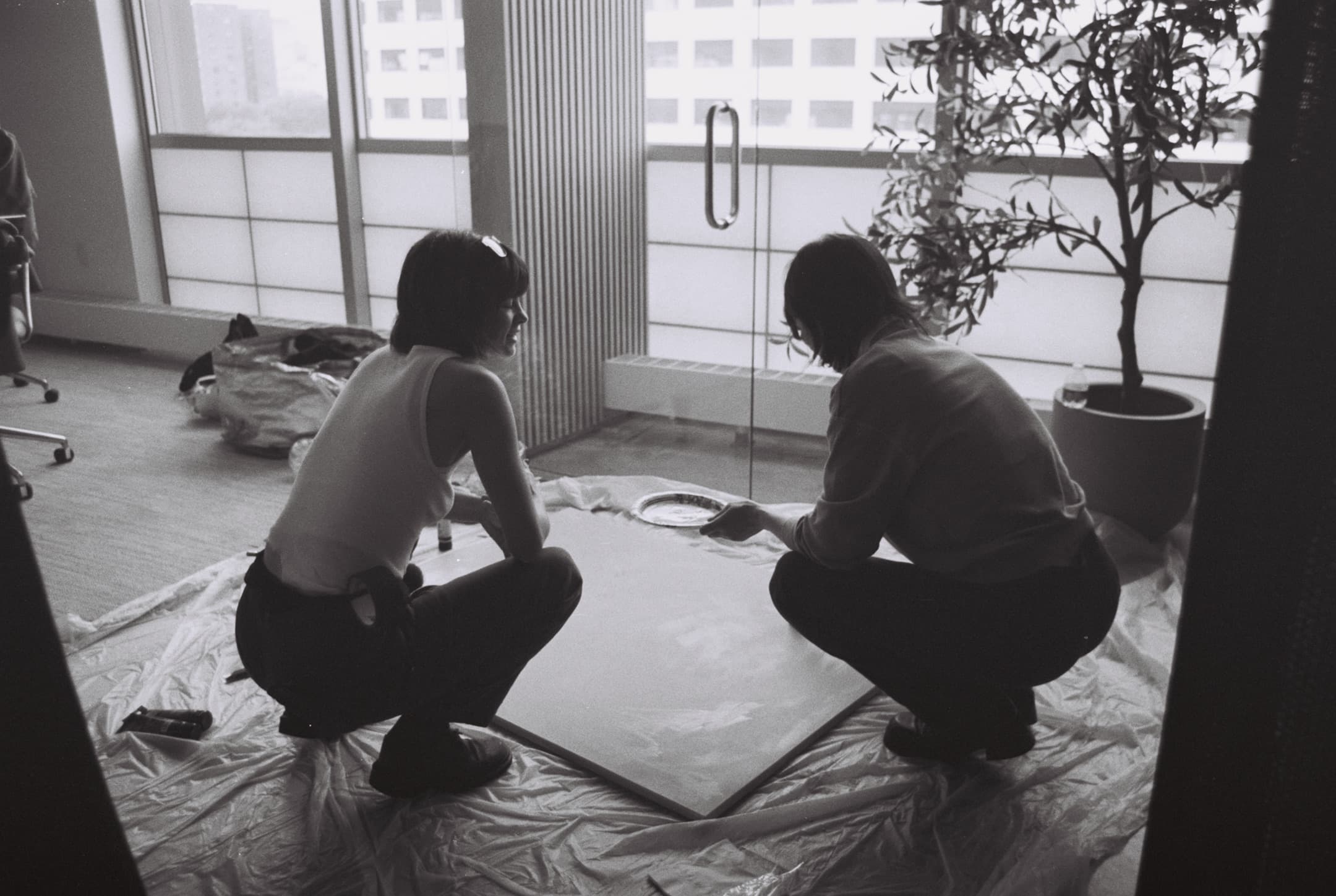 Behind the scenes, on black and white film.
