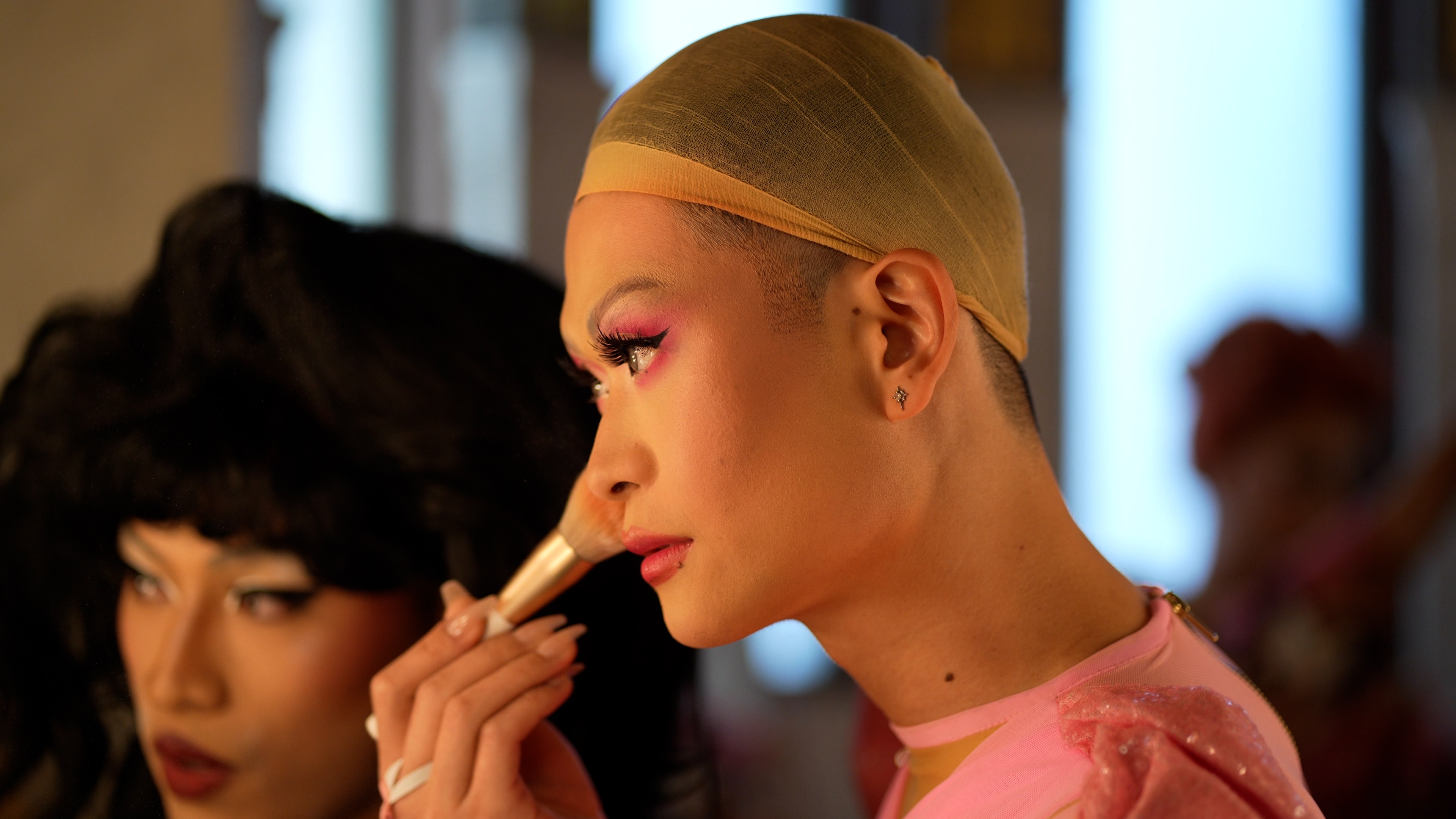 Behind the scenes makeup touch-up for Shimmer.